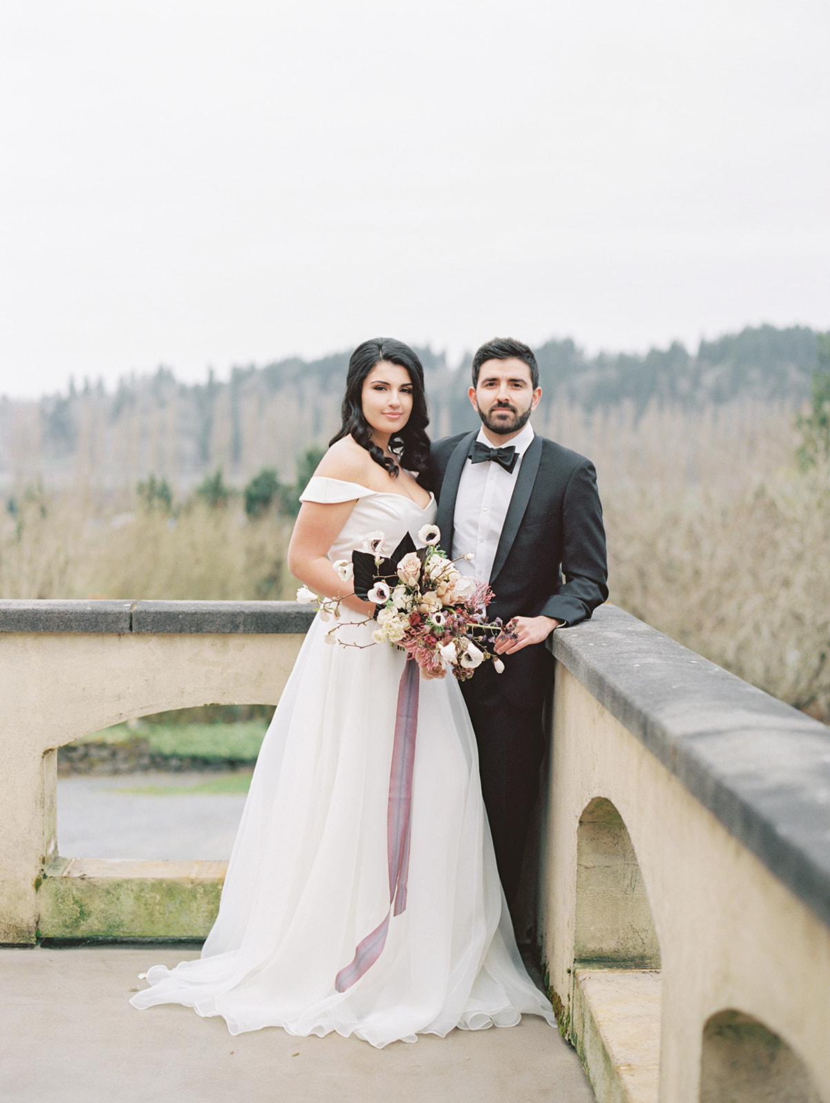 Chateau-Lill-Wedding-Couple-on-Balcony-Holding-Bouquet.jpg The bride and groom standing on the balcony of Chateau Lill, holding the bouquet