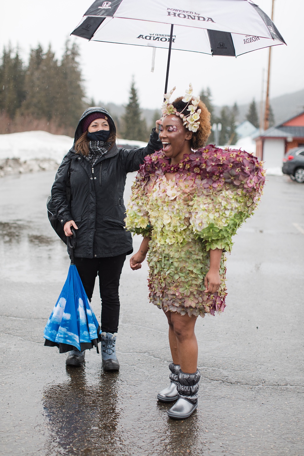 Seattle-Wedding-Florist-Bloom-Poet-Couture-Flower-Dress-American-Flowers-Week-2021-Pamela-and-Tasia Hellebore grower Pamela on the left, holding an umbrella for our model Tasia, on the right