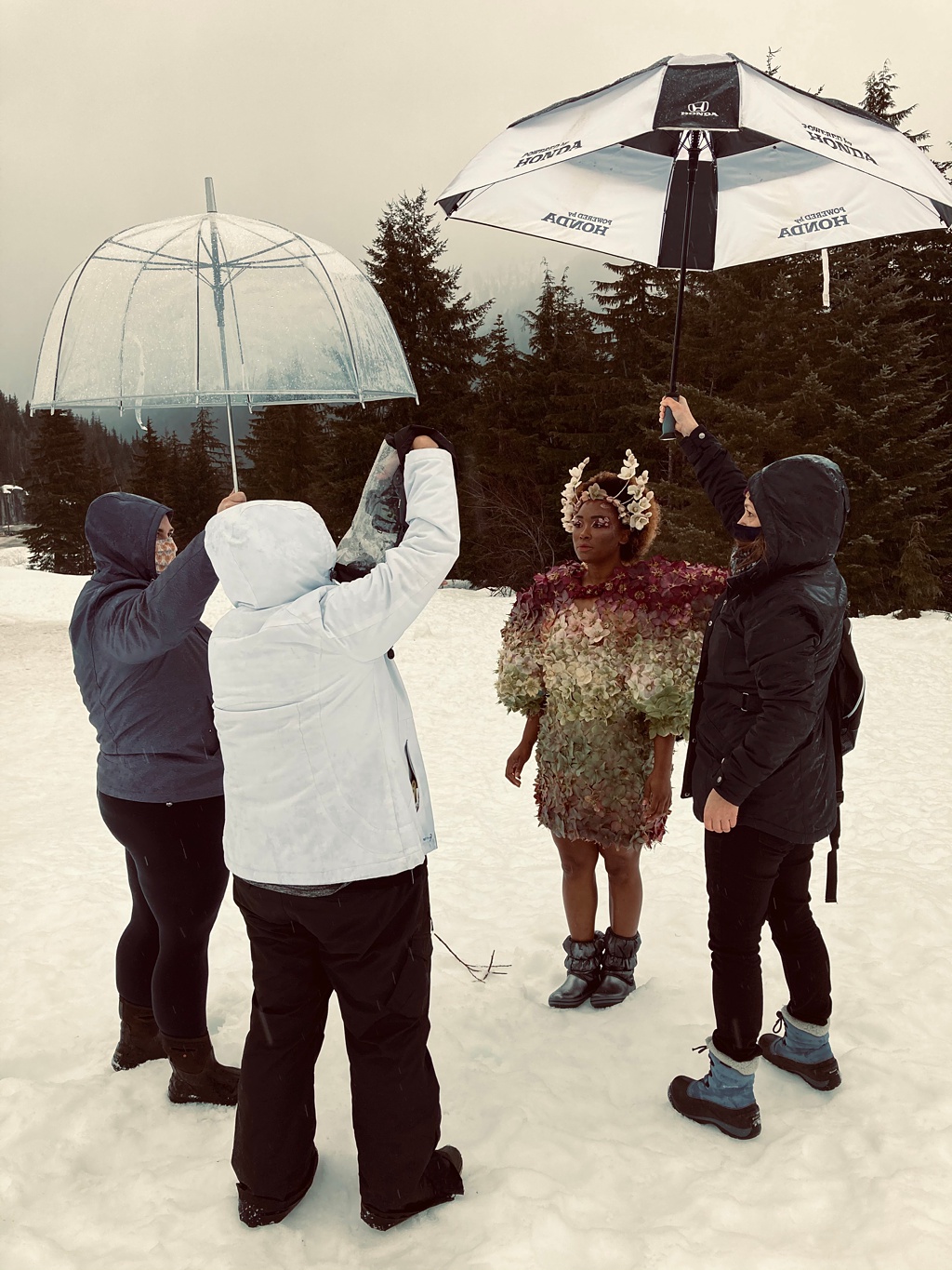 Seattle-Wedding-Florist-Bloom-Poet-Couture-Flower-Dress-American-Flowers-Week-2021-The-Team The team working together to protect Tasia from the freezing rain!