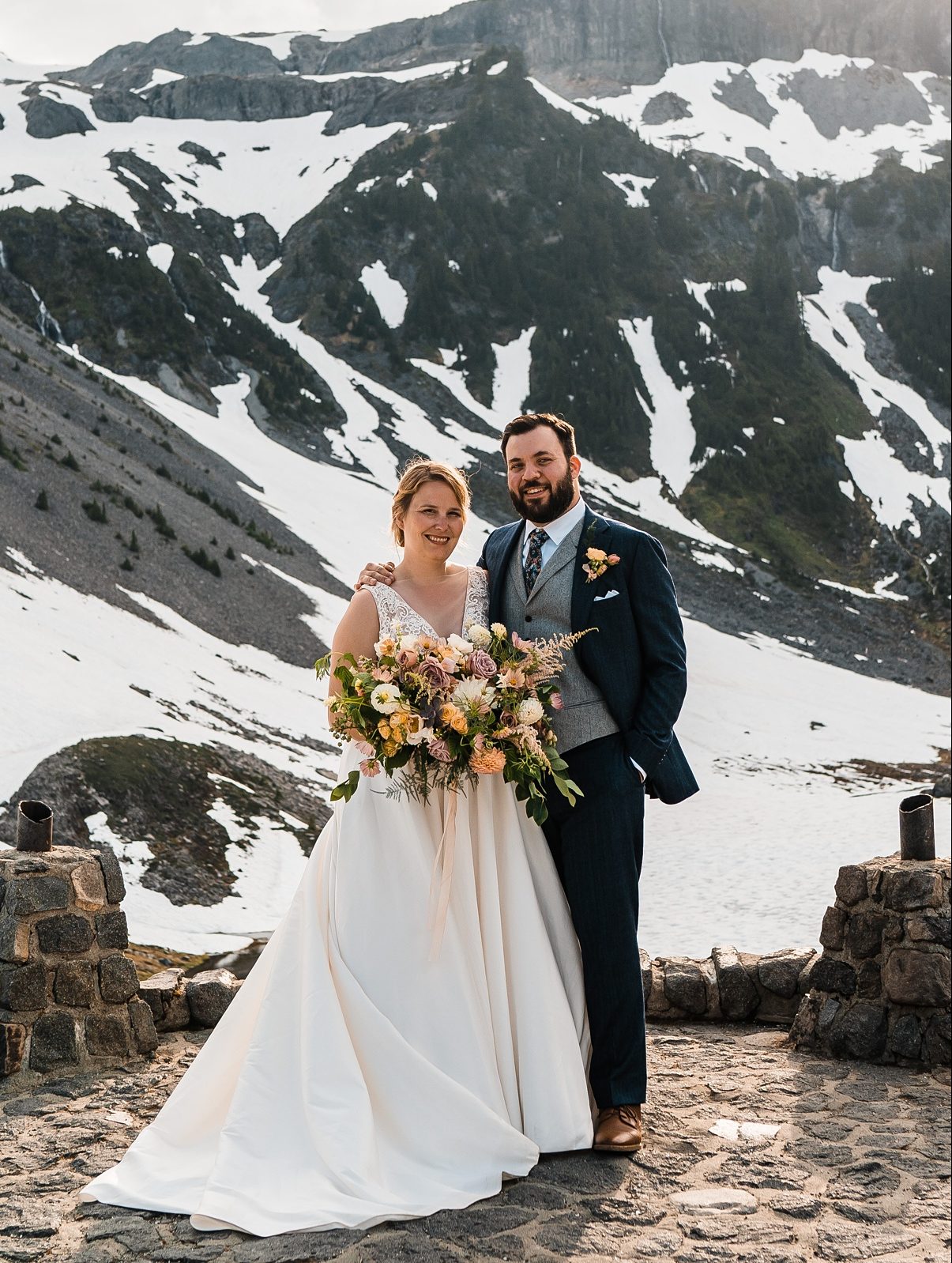 Seattle-Wedding-Florist-Bloom-Poet-Destination-Wedding-Cover-Image.jpg a couple standing in front of a mountain destination wedding
