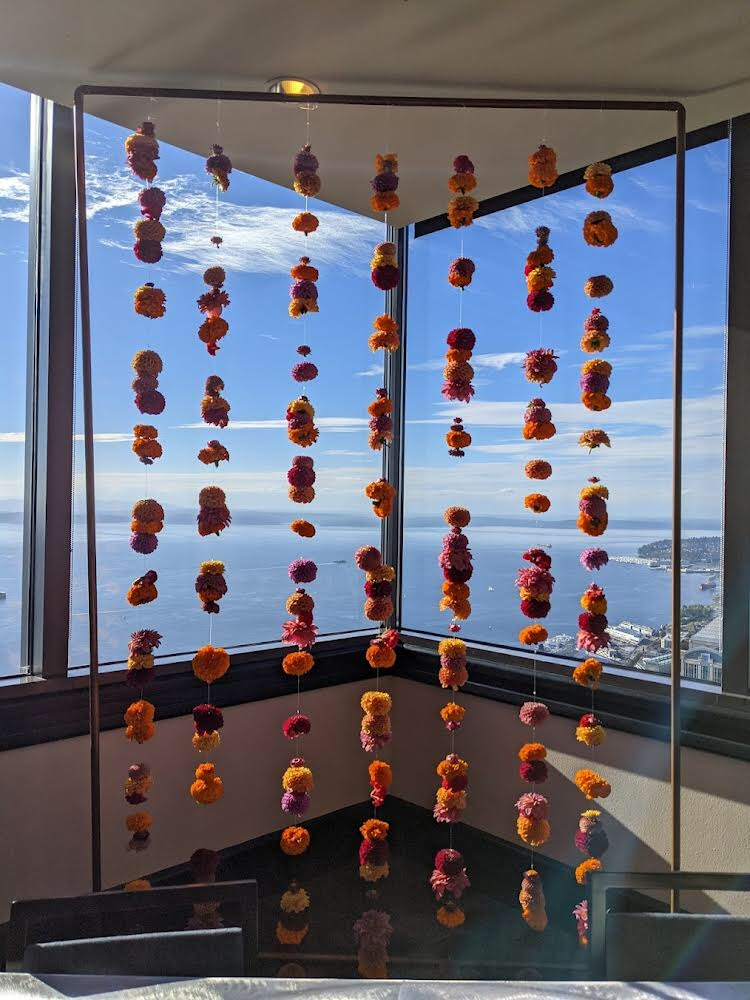 folk art flowers columbia tower club wedding a floral installation with flower strands in the columbia tower club