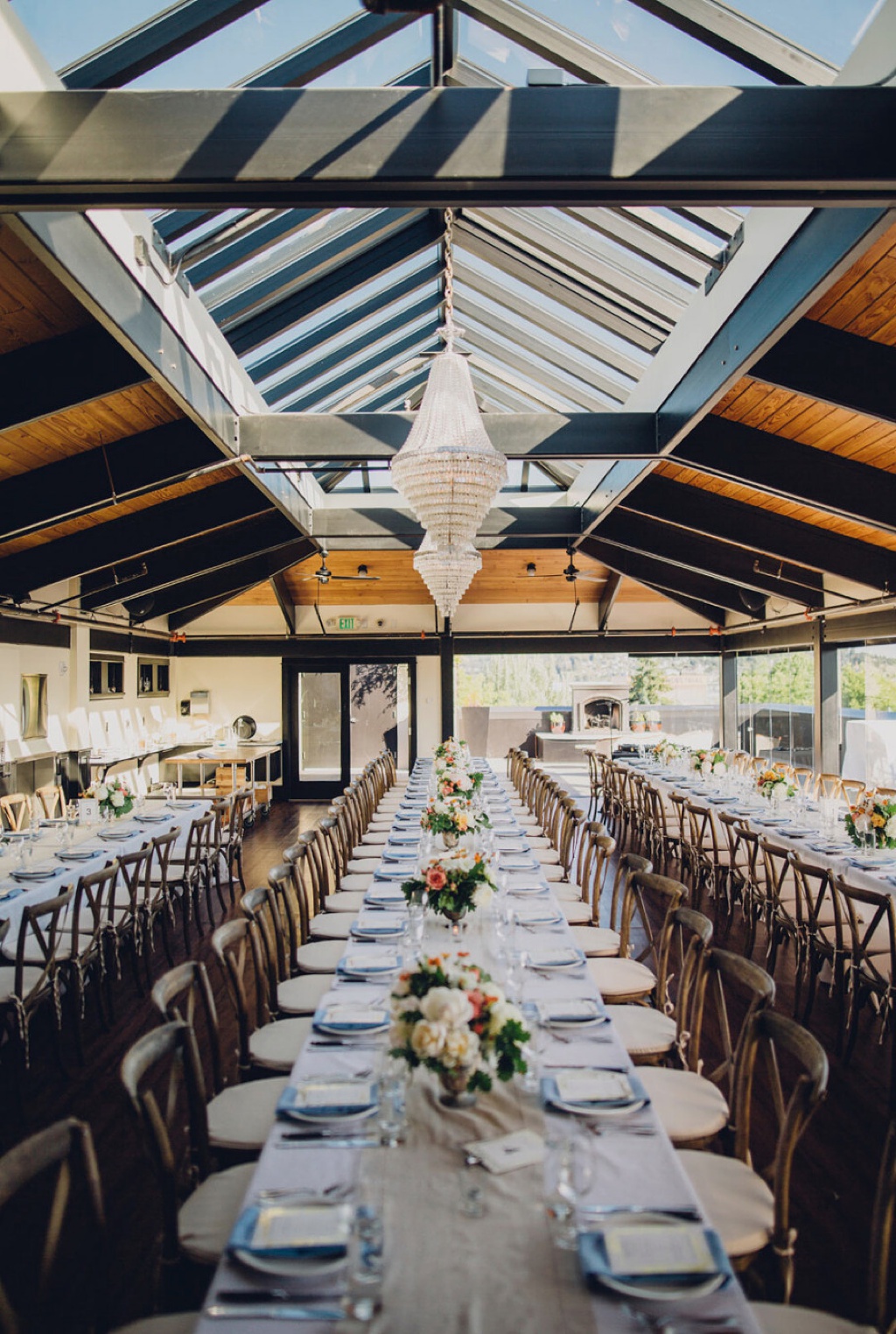 Long tables set under the skylight of the Olympic Rooftop Pavillion
