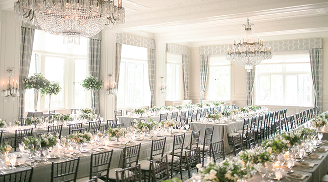 The Rainier Club the indoor space of the rainier club, with long tables, crystal chandeliers, high windows, and beautiful molded ceilings