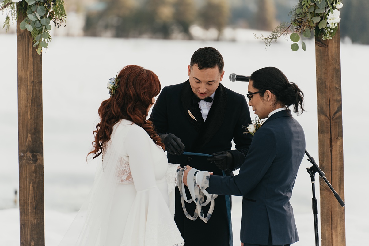 Winter-Destination-Wedding-Mountain-Springs-Lodge-Final-Handfasting Final handfasting ribbon for wedding ceremony