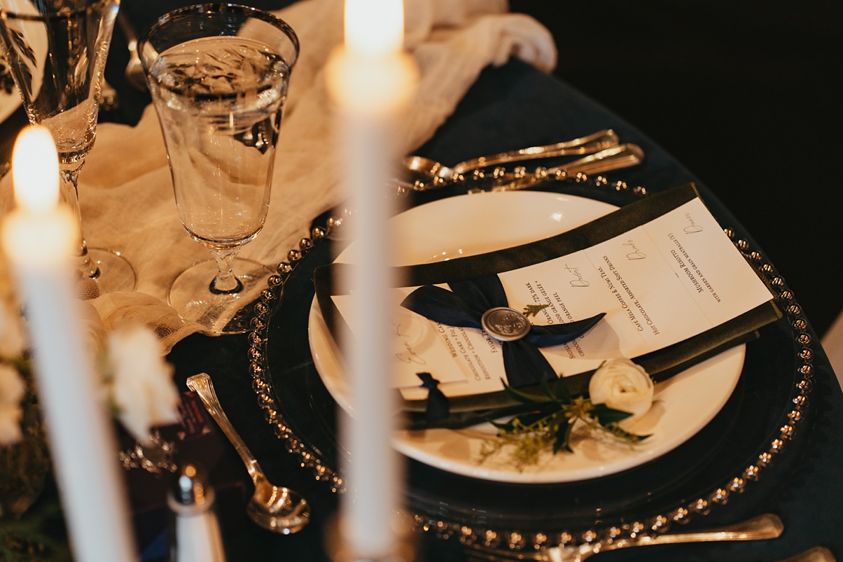 Winter-Destination-Wedding-Mountain-Springs-Lodge-Romantic-Reception Sweetheart table details like candles, menus, and wax seals for this romantic wedding reception
