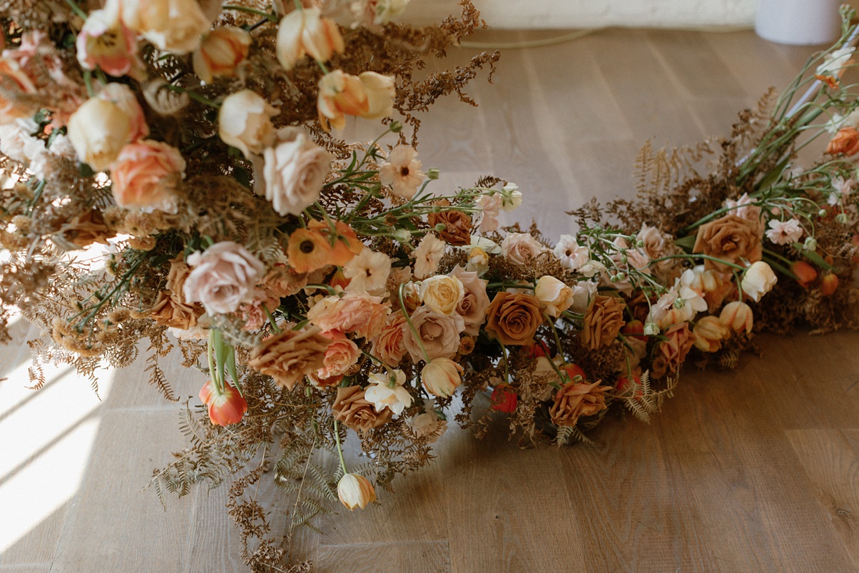 The bottom of the circular arch at a Block 41 wedding, covered in flowers