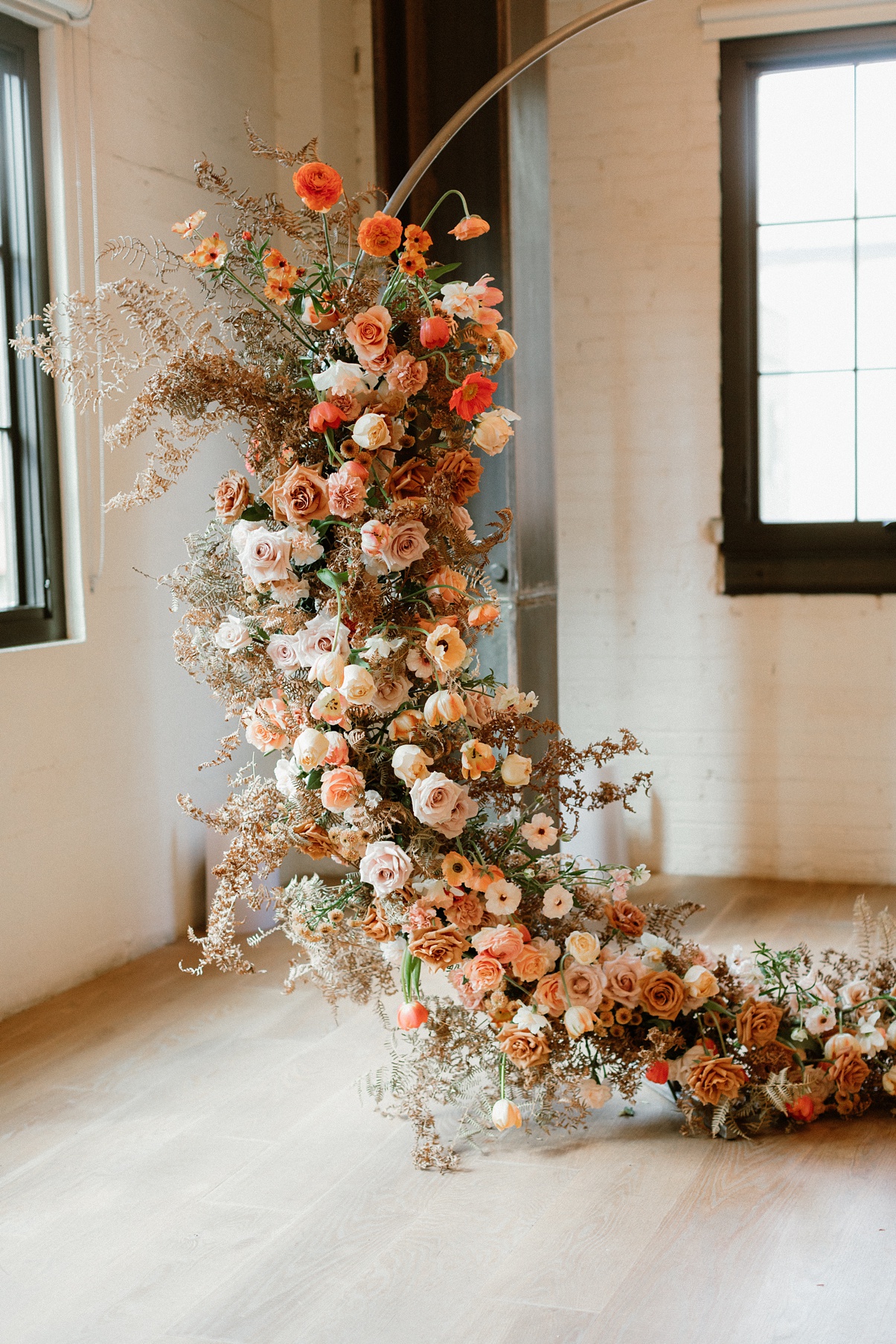 A closeup of the floral installation on the Block 41 wedding arch