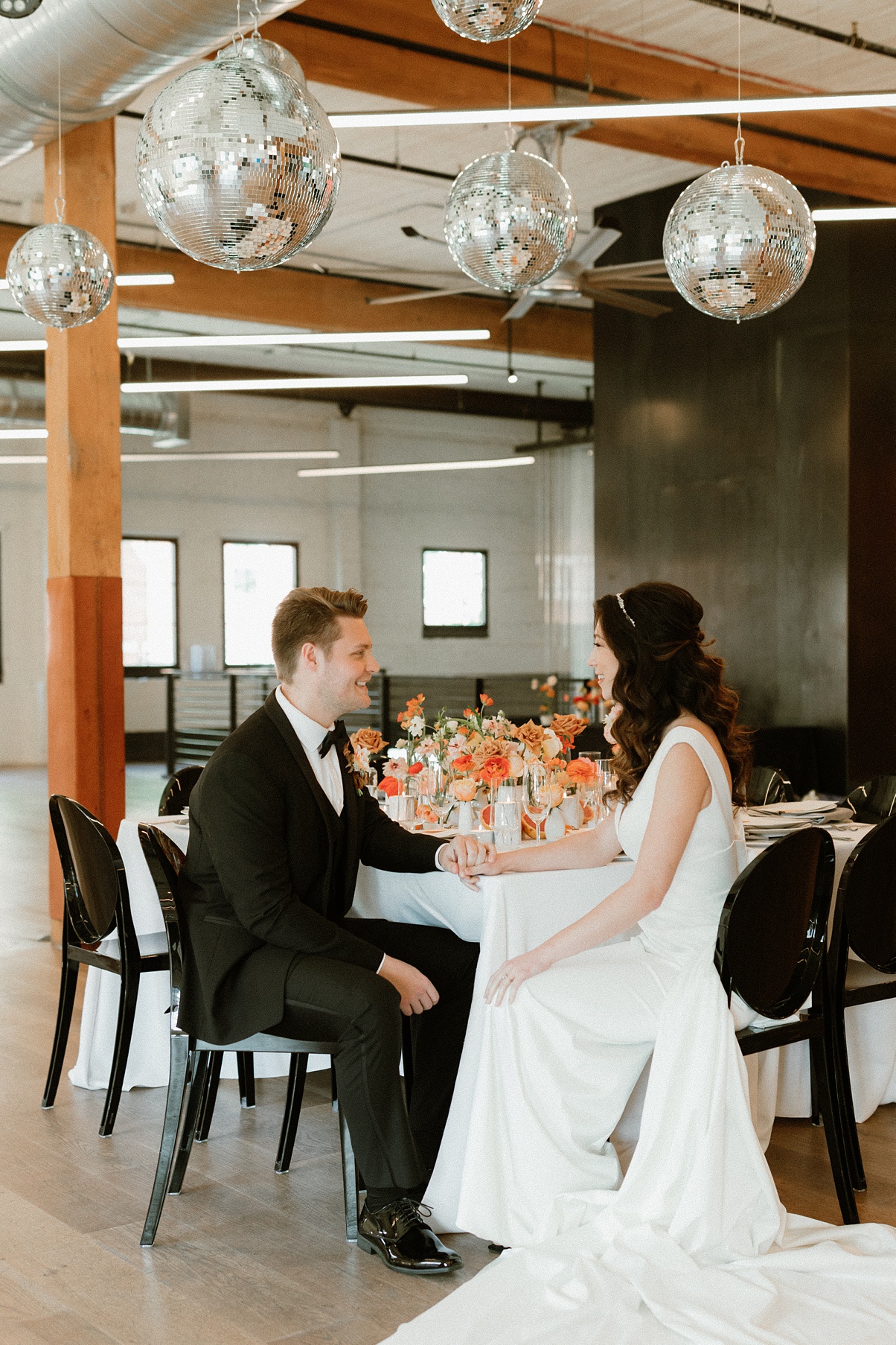 The couple sitting at their head table at Block 41