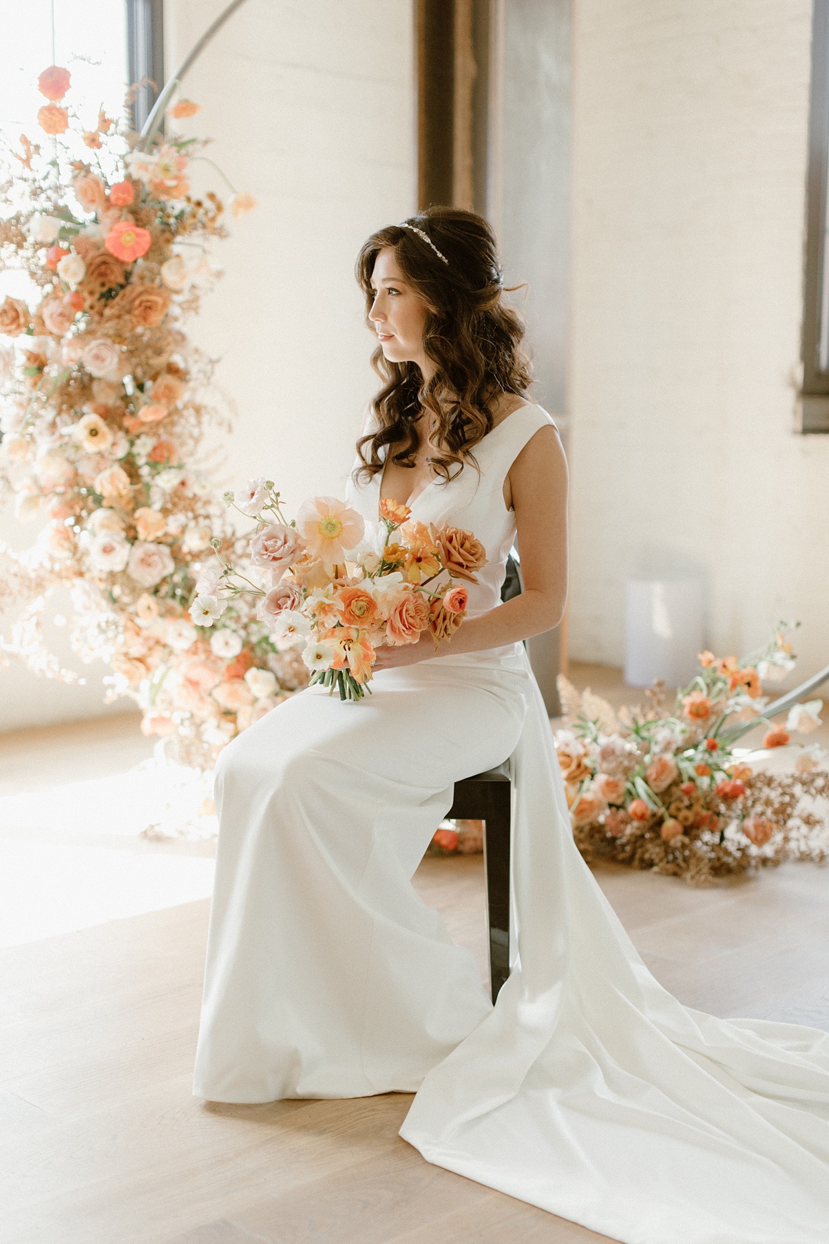 Bridal portrait at Block 41 wedding in front of circle arch, covered in flowers