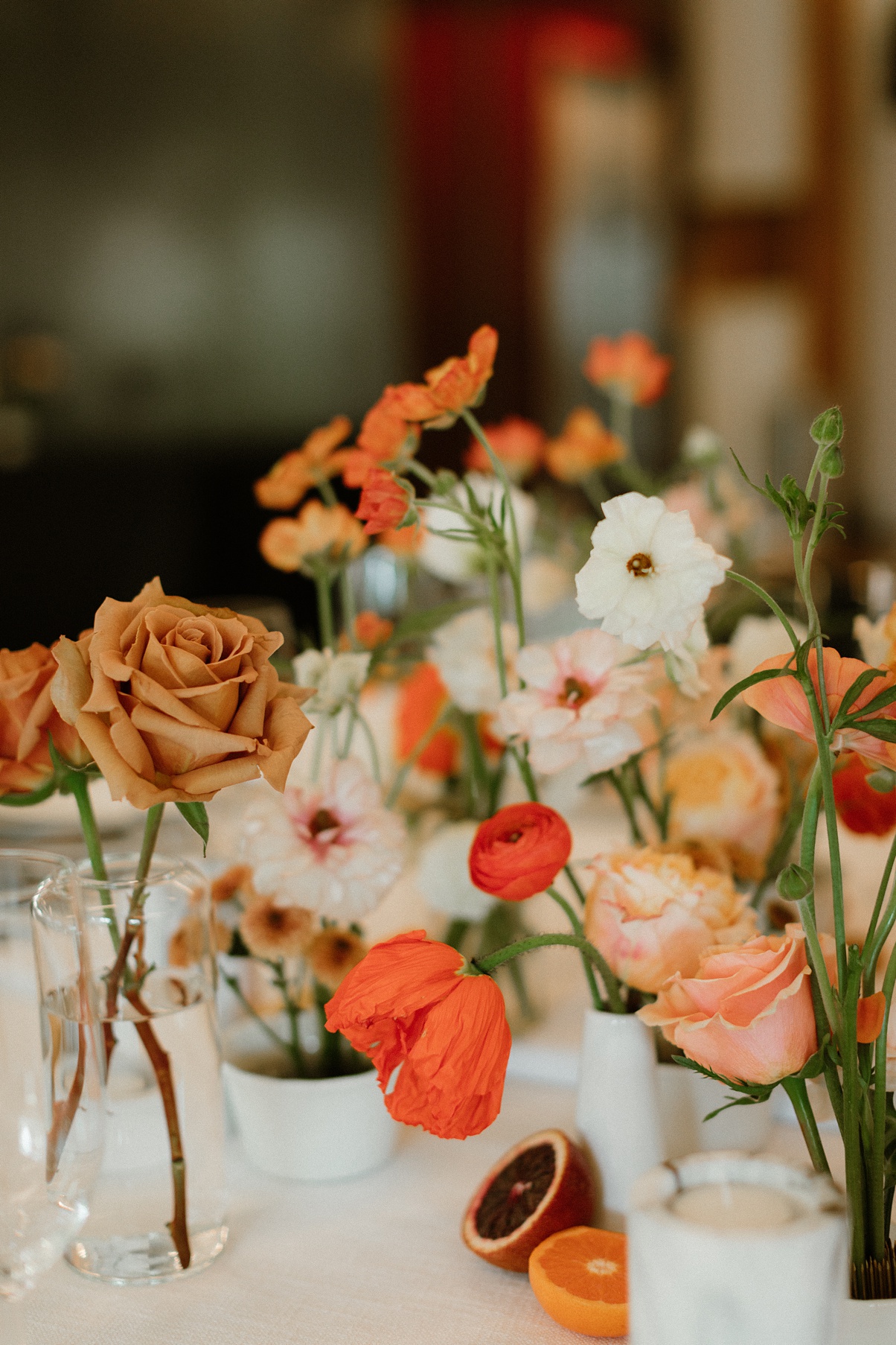 Flowers in bud vases on the Block 41 wedding kings table