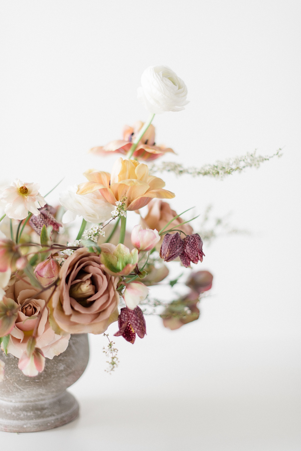 Seattle-Wedding-Florist-Bloom-Poet-Centerpiece A floral compote wedding centerpiece with white, taupe, mauve, and blush spring flowers