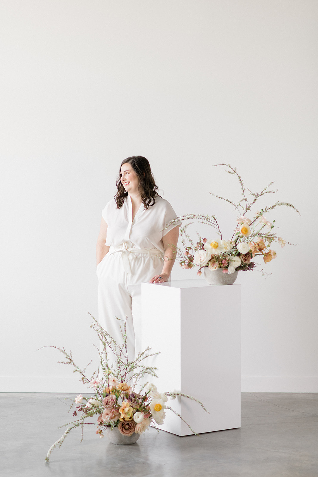 Bloom-Poet-Seattle-Wedding-Florist-Work-With-Us-Carolyn-Kulb Owner Carolyn Kulb standing with flowers