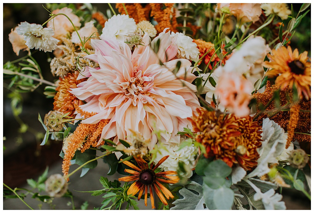 A closeup of the fall wedding bouquet and cafe au lait dahlia