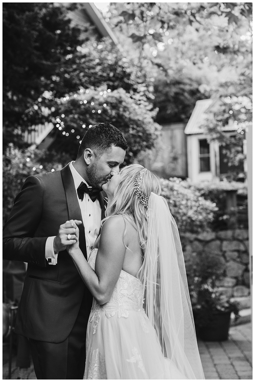 the bride and groom share a romantic dance and kiss