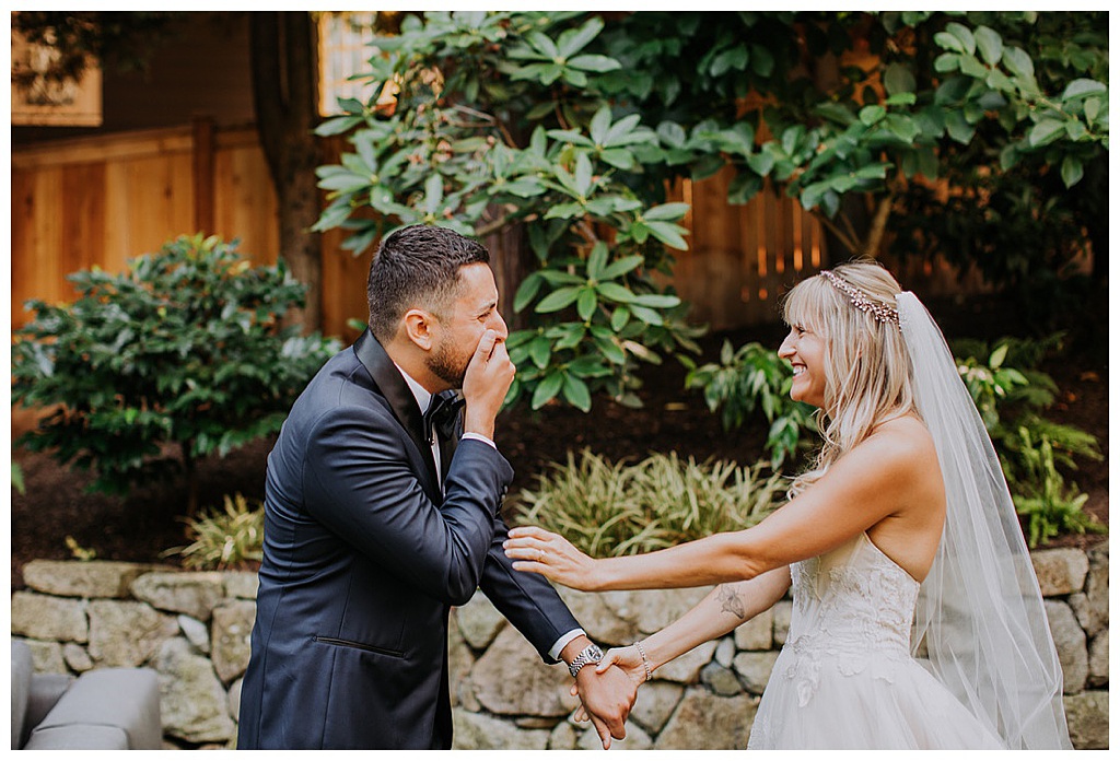 The groom reacts to the first look