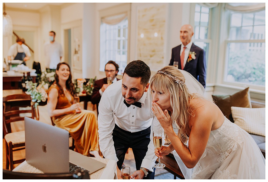 The couples blow kisses to their wedding attendees via zoom
