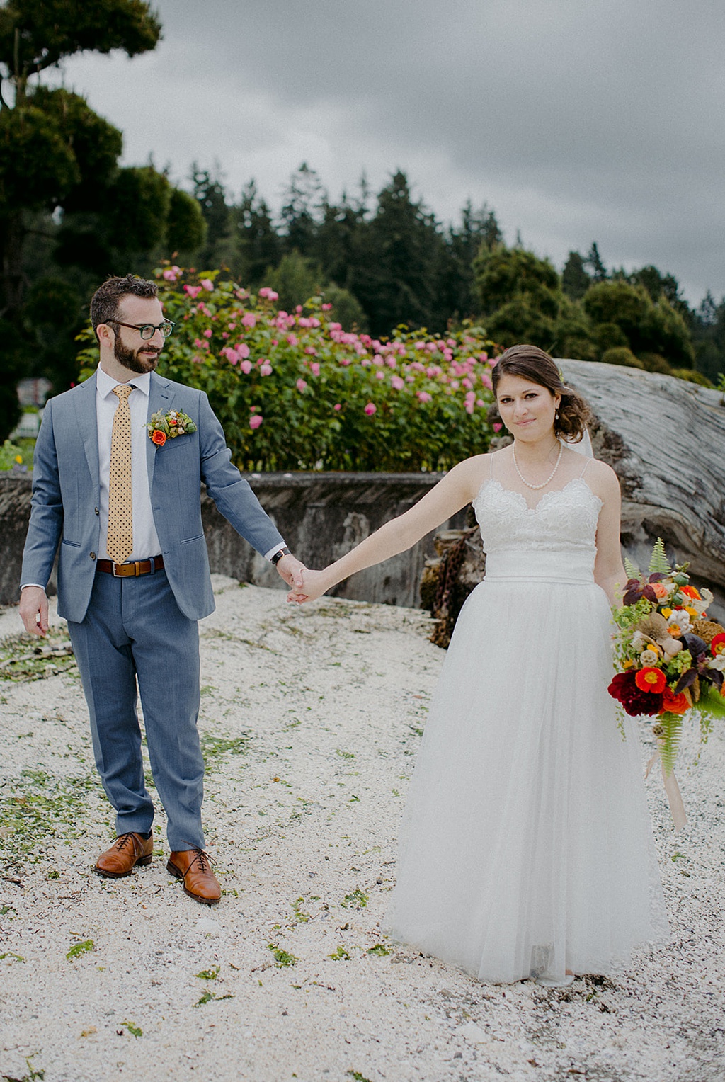 A couple standing at Kiana Lodge holding hands