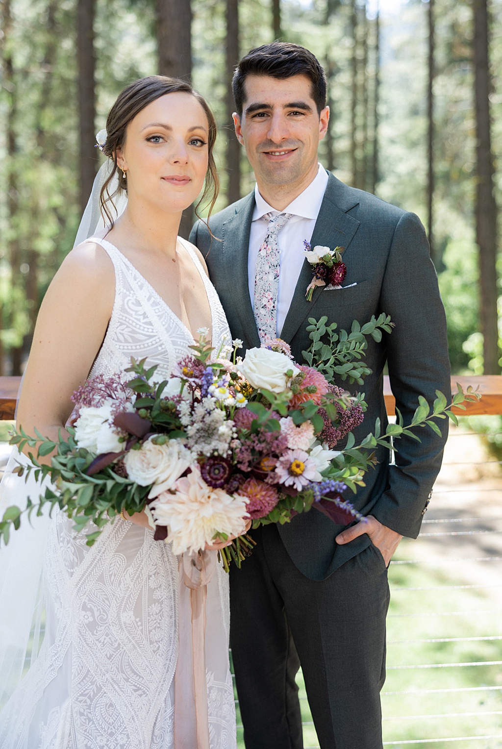 Bloom-Poet-Seattle-Wedding-Florist-Tierra-Retreat-Center-Wedding-Couple-and-Bouquet The bride and groom pose with the bridal bouquet at the ceremony