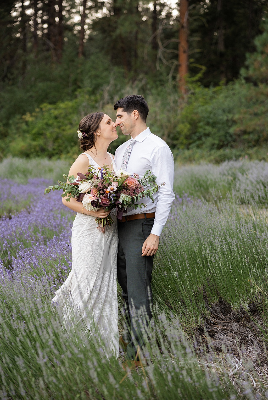 Bloom-Poet-Seattle-Wedding-Florist-Tierra-Retreat-Center-Wedding-Lavender-Fields The couple stands in a lavender field at this Tierra Retreat Center wedding